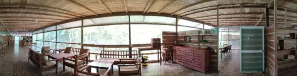 Comfortable living area inside a wooden jungle eco-lodge in Peru's Amazon rainforest, feat